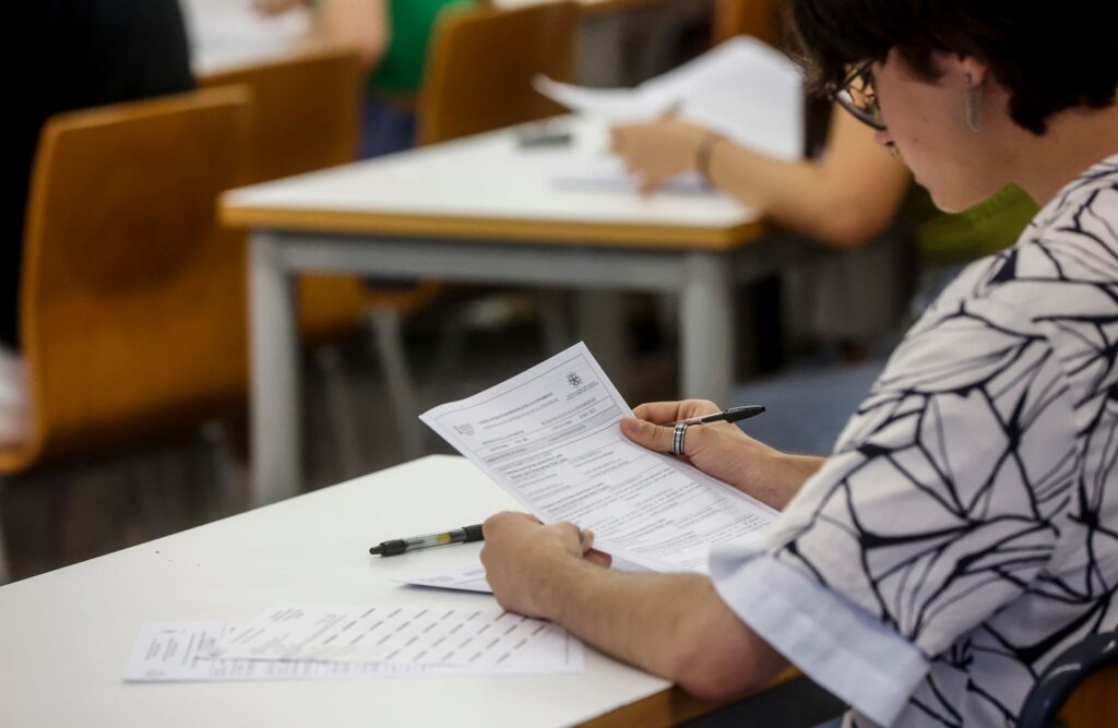 Student being careful to avoid careless errors in gcse maths